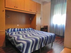 Postel nebo postele na pokoji v ubytování Hotel Antonella