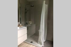 a bathroom with a shower with a white shower curtain at LA CHOZA VILLA VACACIONAL in Teror +38 photos