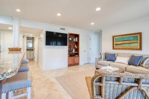 a living room with a couch and a table at 4727 Tennis Club in Kiawah Island