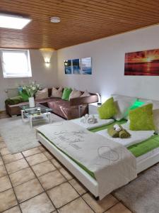 a living room with two beds and a couch at Apartment H2 Düsseldorf in Düsseldorf