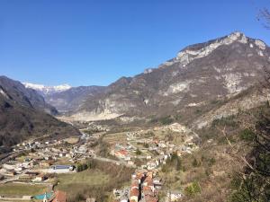 a town in a valley with mountains in the background at La Casa dei Gelsomini in Arsiero