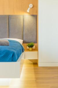 Łóżko lub łóżka w pokoju w obiekcie Royal Manu Apartment NETFLIX