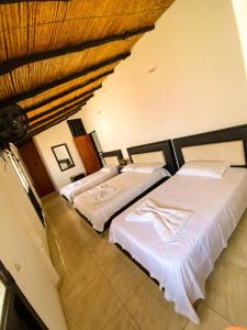 Ein Bett oder Betten in einem Zimmer der Unterkunft Hotel Mirador de Santa Bárbara