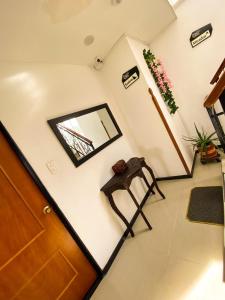 a room with a mirror and a chair in it at Hotel Mirador de Santa Bárbara in Socorro +41 photos