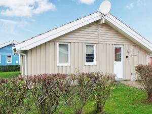 a house with a white at 6 person holiday home in Gelting in Gelting