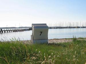 un bloque con el número sentado en la playa en 6 person holiday home in Gelting, en Gelting