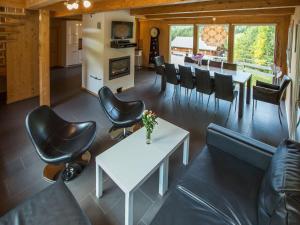 a living room with a white table and chairs at Chalet in Annaberg-Lungötz with terrace in Annaberg im Lammertal