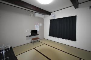 Een TV en/of entertainmentcenter bij Guest House Shizuho
