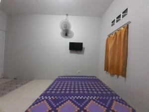 Rumah Rahman Syari'ah tesisinde bir odada yatak veya yataklar