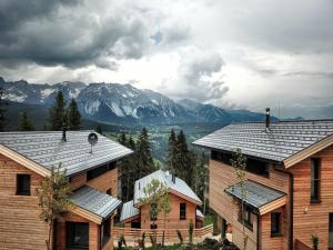 a group of houses with mountains in the background at Ski In Ski Out Chalet Reiteralm 11 in Schladming