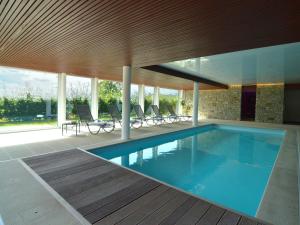 a swimming pool in the middle of a house at Holiday Home in Malmedy with Indoor Heated Pool in Malmedy