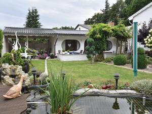 Gallery image of Homey Bungalow with Roofed Terrace Garden Garden Furniture in Neubukow