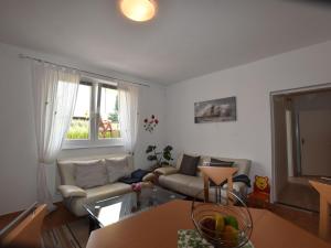 a living room with a couch and a table at Apartment in Ravensberg with BBQ, Terrace, Fenced Garden in Ravensberg