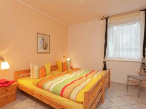 a bedroom with a wooden bed in a room at Luxury holiday home in Elend with private pool in Elend
