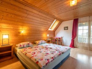 a bedroom with a bed in a wooden room at Ferienwohnung mit Talblick in Todtmoos in Todtmoos