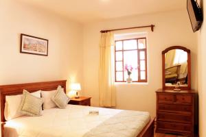 Postel nebo postele na pokoji v ubytování Casa Hotel Las Plazas