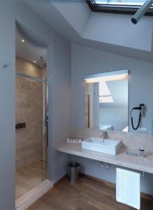 a bathroom with a sink and a shower at Posta Design Hotel in Como