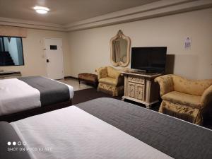 Voodi või voodid majutusasutuse Hotel Frontiere Tijuana toas