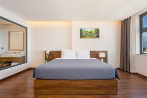 Postel nebo postele na pokoji v ubytování Avenis Hotel