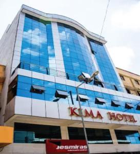 a large building with a billboard on the side of it at KIMA HILLS HOTEL in Nairobi