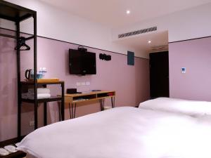 Krevet ili kreveti u jedinici u okviru objekta River Inn Kenting