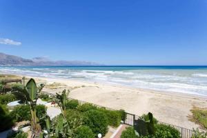 a view of a beach with the ocean at Dune Home alloggi sul mare in Alcamo Marina