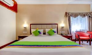 RR INN Group Of Hotels客房内的一张或多张床位