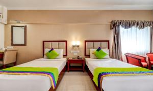 RR INN Group Of Hotels客房内的一张或多张床位