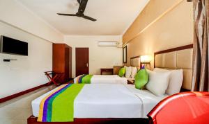 RR INN Group Of Hotels客房内的一张或多张床位