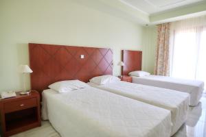 Postel nebo postele na pokoji v ubytování Nefeli Hotel