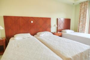 Postel nebo postele na pokoji v ubytování Nefeli Hotel