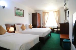 Cama o camas de una habitación en The Rock Hotel
