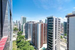 an aerial view of a city with tall buildings at Boa Viagem Flat in Recife