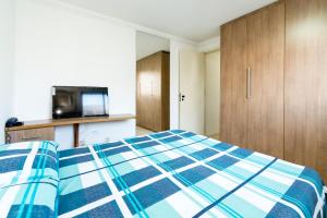 Cama o camas de una habitación en Boa Viagem Flat