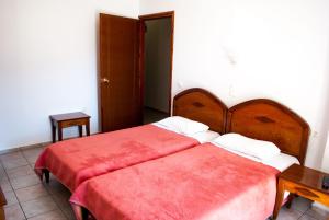 Postel nebo postele na pokoji v ubytování Hotel Gigilos Omalos