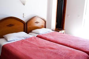 Postel nebo postele na pokoji v ubytování Hotel Gigilos Omalos