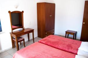 Postel nebo postele na pokoji v ubytování Hotel Gigilos Omalos
