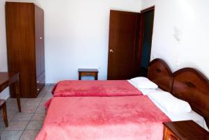 Postel nebo postele na pokoji v ubytování Hotel Gigilos Omalos