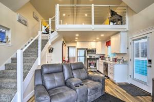 a living room with a couch and a staircase at Epic Yachats Escape with Beach Access and Views! in Yachats