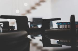 a row of black chairs in a waiting room at Case Playa Resort Balestrate in Balestrate +136 photos