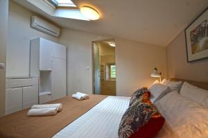 Postel nebo postele na pokoji v ubytování App & Rooms Juraga + 37 fotografií