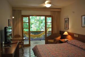 Cama ou camas em um quarto em Hotel 7 Colinas