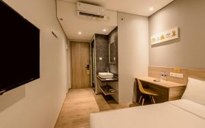 Letto o letti in una camera di Yellow Bee Tanah Abang