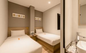 Letto o letti in una camera di Yellow Bee Tanah Abang