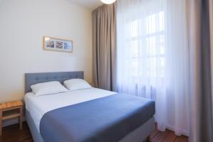 Łóżko lub łóżka w pokoju w obiekcie Apartamenty Świnoujście - Villa Stil 1