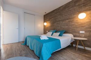 Posteľ alebo postele v izbe v ubytovaní Apartamentos Playa Canutells