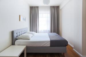 Łóżko lub łóżka w pokoju w obiekcie Apartamenty Świnoujście - Villa Stil 1