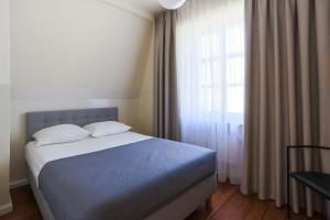 Łóżko lub łóżka w pokoju w obiekcie Apartamenty Świnoujście - Villa Stil 1