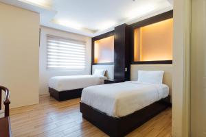 Llit o llits en una habitació de Northpointe Residences