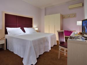 Postel nebo postele na pokoji v ubytování Hotel Terme Marco Polo